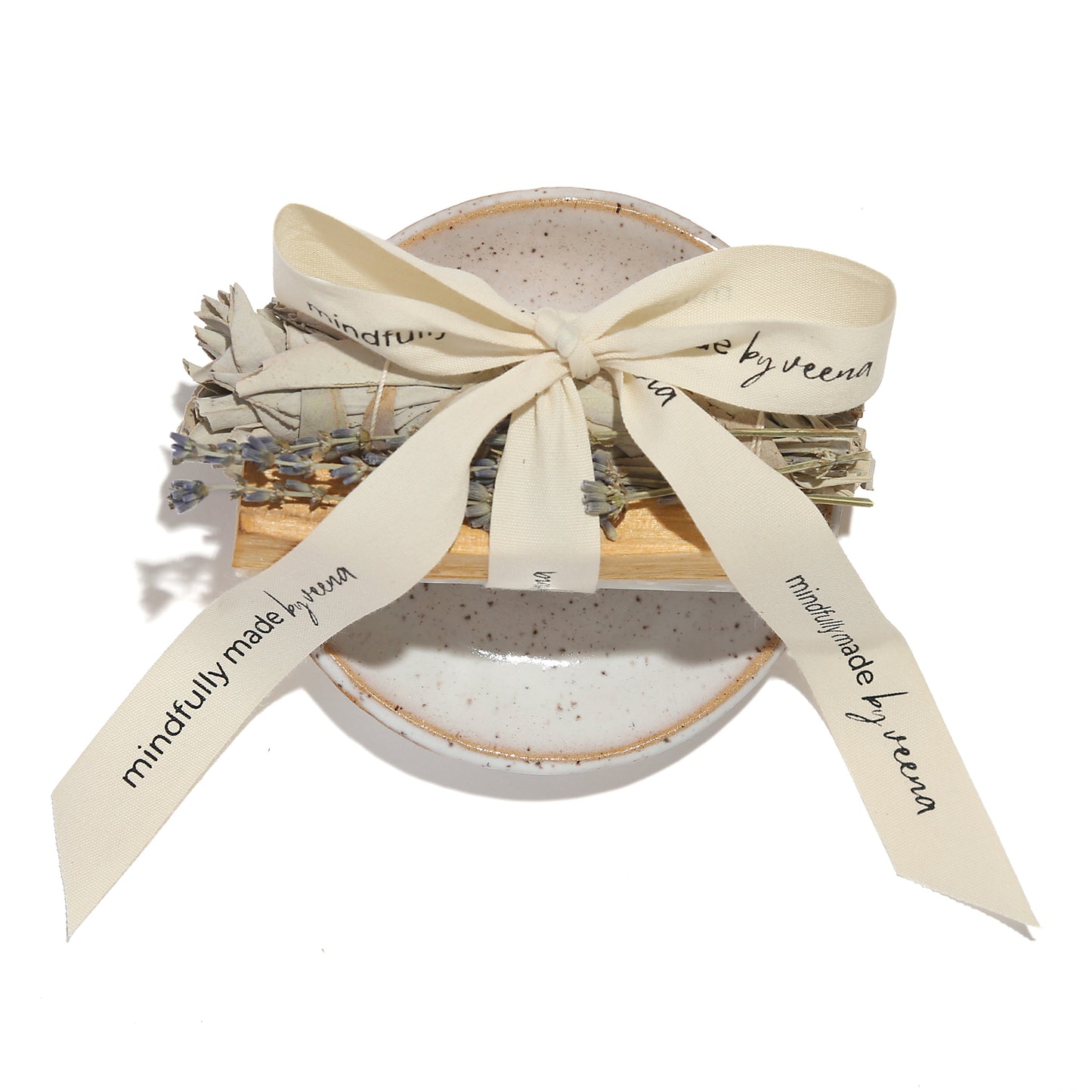 Jar of bath salts with lavender and eucalyptus, tied with a ribbon, on a white background